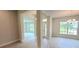 Open entryway with tile floors and views into adjacent living and dining areas at 2536 Jacobs St, Port Charlotte, FL 33953