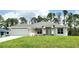 Newly built home with grey roof, white exterior, and landscaping at 2536 Jacobs St, Port Charlotte, FL 33953