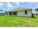 Single-story home with covered patio and large backyard at 2536 Jacobs St, Port Charlotte, FL 33953