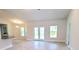 Spacious living room with tile floors and sliding glass doors leading to the outdoors at 2536 Jacobs St, Port Charlotte, FL 33953