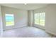 Bright living room with large windows and tile flooring at 2536 Jacobs St, Port Charlotte, FL 33953