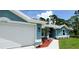 Close-up view of the home's exterior featuring a two-car garage at 2552 Jacobs St, Port Charlotte, FL 33953