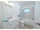 Clean bathroom with white vanity, shower, and modern fixtures at 5731 Oakview Ln, Punta Gorda, FL 33950