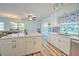 Spacious kitchen island with white cabinets and quartz countertops at 5731 Oakview Ln, Punta Gorda, FL 33950