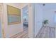 Bright hallway with light wood floors, leading to bedrooms and bath at 5731 Oakview Ln, Punta Gorda, FL 33950