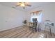 Home office in bright bedroom with wood desk and large window at 5731 Oakview Ln, Punta Gorda, FL 33950