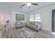 Living area featuring hardwood floors, comfortable seating, and natural light at 5731 Oakview Ln, Punta Gorda, FL 33950