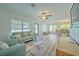 Bright and airy living room with hardwood floors and ample natural light at 5731 Oakview Ln, Punta Gorda, FL 33950