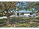 Single story home with metal roof and stone facade at 5731 Oakview Ln, Punta Gorda, FL 33950