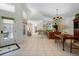Bright dining room with hardwood floors and view into the kitchen at 15 Windward Pl, Placida, FL 33946