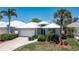 Exterior of home showcasing landscaping and driveway at 15 Windward Pl, Placida, FL 33946
