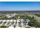 Aerial view showing home's location in a golf course community at 15 Windward Pl, Placida, FL 33946