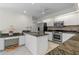 Modern kitchen with granite countertops and stainless steel appliances at 15 Windward Pl, Placida, FL 33946