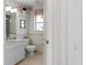 Clean bathroom with a toilet, sink, and shower at 15 Windward Pl, Placida, FL 33946