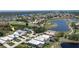 Aerial view of home on golf course community with lake views at 15 Windward Pl, Placida, FL 33946