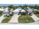 Home's exterior view, showcasing landscaping and driveway at 15 Windward Pl, Placida, FL 33946