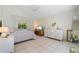 Bright bedroom with a queen-size bed and ample closet space at 15 Windward Pl, Placida, FL 33946