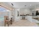 Bright kitchen with breakfast nook, granite counters, and pool view at 15 Windward Pl, Placida, FL 33946