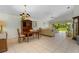 Bright dining room featuring a wood table, chairs, and a large window at 15 Windward Pl, Placida, FL 33946