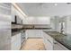 Kitchen with granite countertops, stainless steel appliances, and island at 15 Windward Pl, Placida, FL 33946