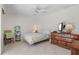 Bedroom with a queen bed, dresser, and ceiling fan at 15 Windward Pl, Placida, FL 33946
