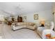 Spacious living room with a large sectional sofa and view of the backyard at 15 Windward Pl, Placida, FL 33946