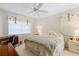 Bedroom with a queen bed, desk, and window blinds at 15 Windward Pl, Placida, FL 33946