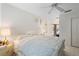 Bright bedroom with a queen-size bed and access to a patio at 15 Windward Pl, Placida, FL 33946