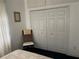 Large bedroom closet with double doors and overhead storage at 18029 Ohara Dr, Port Charlotte, FL 33948