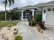 Walkway leading to the entrance of a single-story home at 18029 Ohara Dr, Port Charlotte, FL 33948