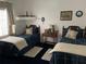 Bedroom with twin beds, nightstand and ample closet space at 18029 Ohara Dr, Port Charlotte, FL 33948