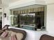 View of the pool through a large window from a covered patio at 18029 Ohara Dr, Port Charlotte, FL 33948