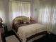 Cozy bedroom with a comfortable bed and ample natural light at 18029 Ohara Dr, Port Charlotte, FL 33948