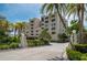 Condo building exterior with palm trees and entrance at 2675 Gulf Of Mexico Dr # 204, Longboat Key, FL 34228