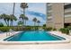 Inviting swimming pool with ample deck space for relaxing at 2675 Gulf Of Mexico Dr # 204, Longboat Key, FL 34228