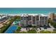 Aerial view of condo, pool, tennis court, and ocean at 2675 Gulf Of Mexico Dr # 204, Longboat Key, FL 34228