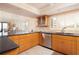 Modern kitchen with stainless steel appliances and granite countertops at 2675 Gulf Of Mexico Dr # 204, Longboat Key, FL 34228
