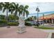White statue near shops and palm trees at 2675 Gulf Of Mexico Dr # 204, Longboat Key, FL 34228