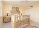 Bedroom with large window and ensuite bathroom at 2675 Gulf Of Mexico Dr # 204, Longboat Key, FL 34228