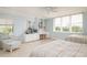 Guest bedroom with two twin beds and built-in desk at 2675 Gulf Of Mexico Dr # 204, Longboat Key, FL 34228