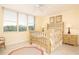 Bedroom with large window and ensuite bathroom at 2675 Gulf Of Mexico Dr # 204, Longboat Key, FL 34228