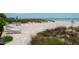 Beach access with lounge chairs and picnic tables at 2675 Gulf Of Mexico Dr # 204, Longboat Key, FL 34228