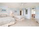 Guest bedroom with two twin beds and ensuite bath at 2675 Gulf Of Mexico Dr # 204, Longboat Key, FL 34228
