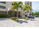 Exterior view of building, showing entrance, landscaping, and parking at 2675 Gulf Of Mexico Dr # 204, Longboat Key, FL 34228