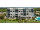 Condo building with balconies and a pool at 2675 Gulf Of Mexico Dr # 204, Longboat Key, FL 34228