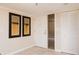 Clean entryway with neutral walls, tiled floor, and built-in storage at 2675 Gulf Of Mexico Dr # 204, Longboat Key, FL 34228