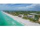 Aerial view of beachfront condo building with ocean views at 2675 Gulf Of Mexico Dr # 204, Longboat Key, FL 34228