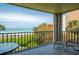 Relaxing balcony with ocean view and seating at 2675 Gulf Of Mexico Dr # 204, Longboat Key, FL 34228