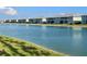 Serene lakefront view of condo community at 3310 Loveland Blvd # 606, Punta Gorda, FL 33980