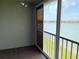 Balcony with lake view and tiled floor at 3310 Loveland Blvd # 606, Punta Gorda, FL 33980